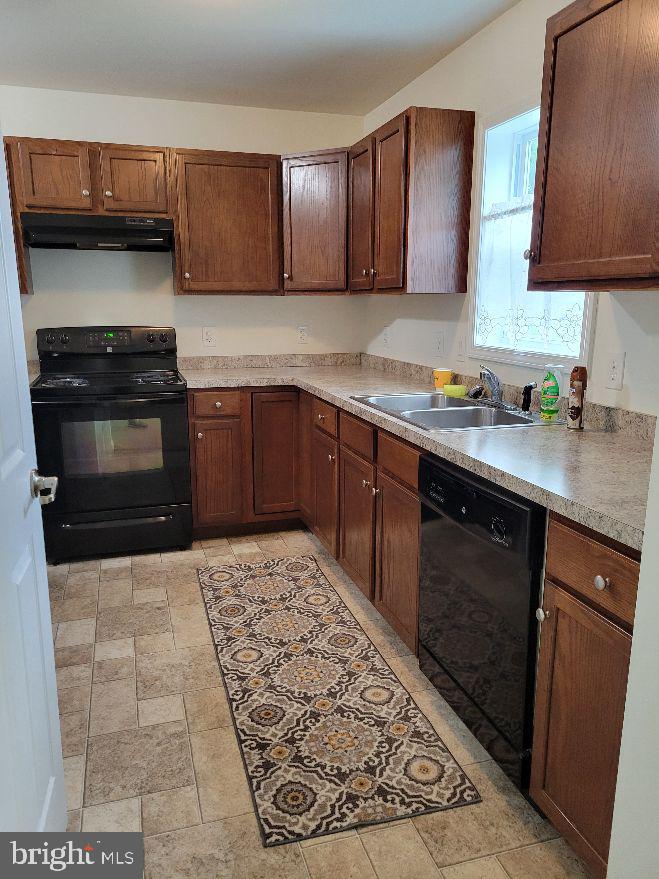 226 Pine Street Dover, DE 19901 - Photo 7 of 20 a kitchen with a sink and a stove top oven