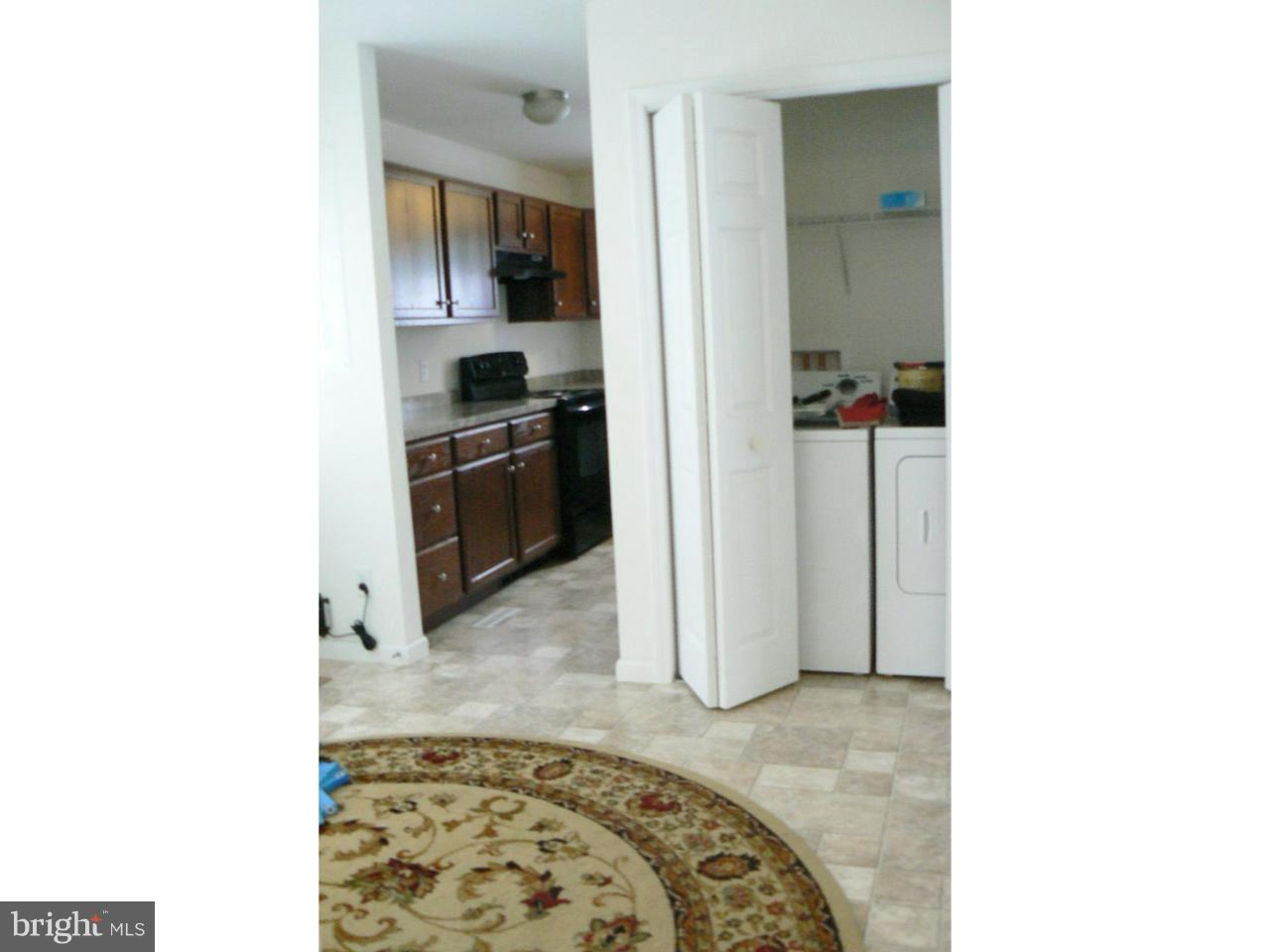 226 Pine Street Dover, DE 19901 - Photo 9 of 20 a kitchen with a stove and a refrigerator