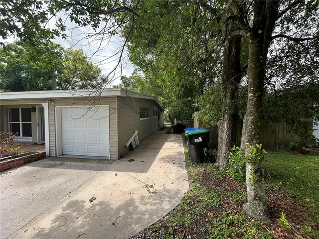a view of a kitchen with a sink and a refrigerator