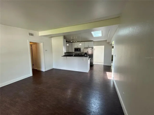 a kitchen with granite countertop a stove and a granite counter tops