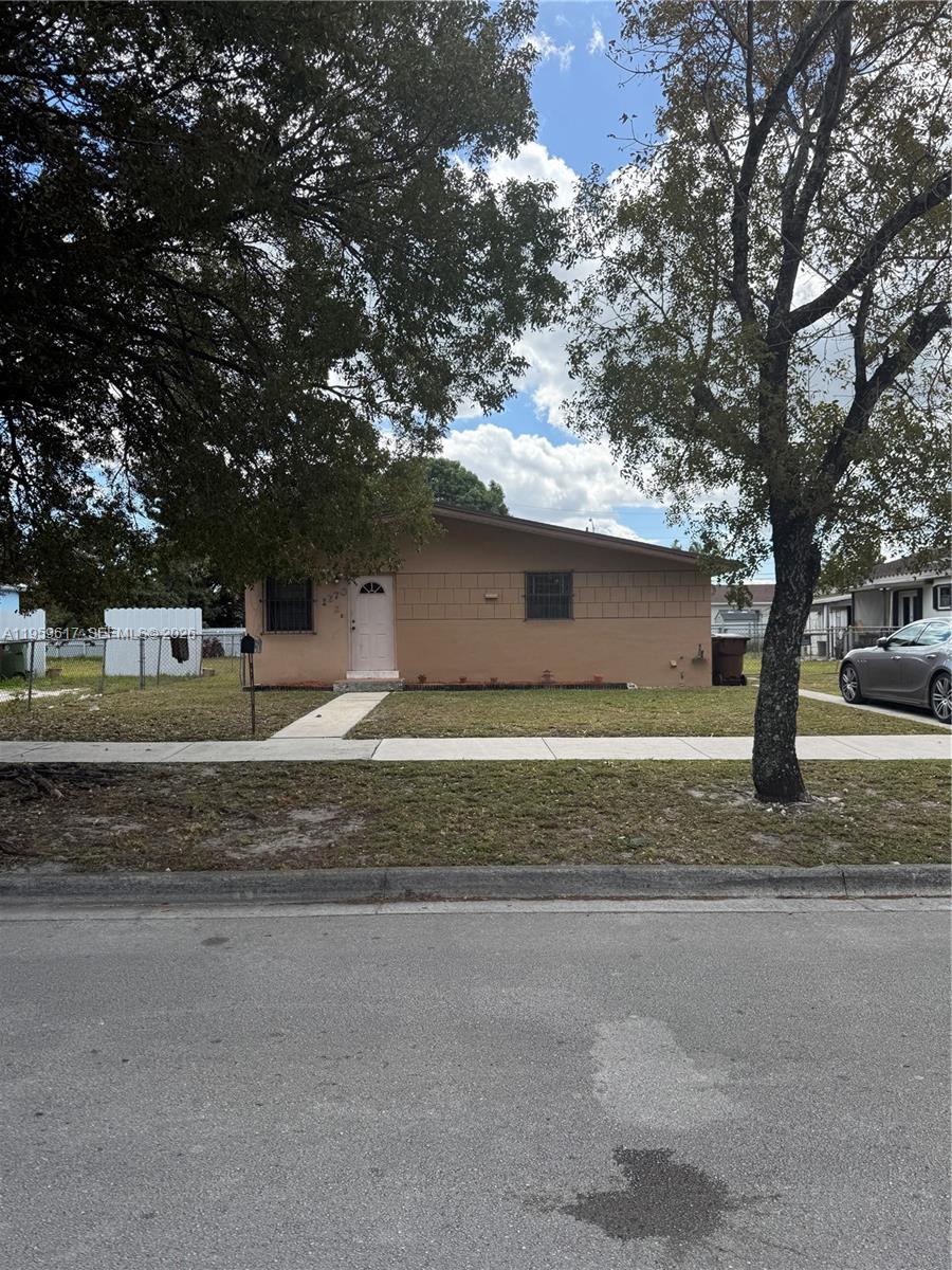1270 West 31st Street Hialeah, FL 33012 - Photo 1 of 12 a view of street along with trees