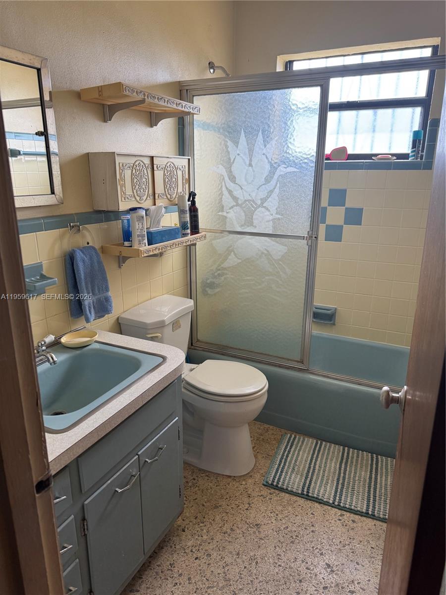 1270 West 31st Street Hialeah, FL 33012 - Photo 7 of 12 a bathroom with a sink a toilet and shower
