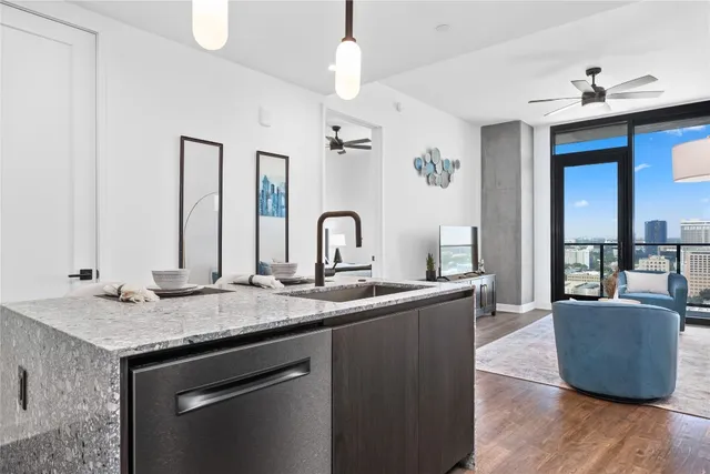 a living room with granite countertop furniture and a sink