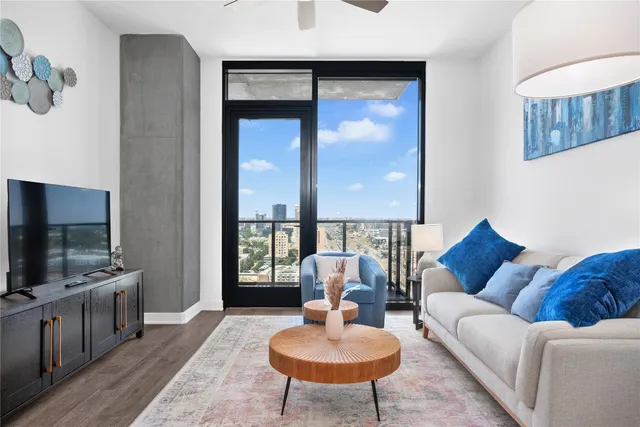 a living room with furniture and a flat screen tv