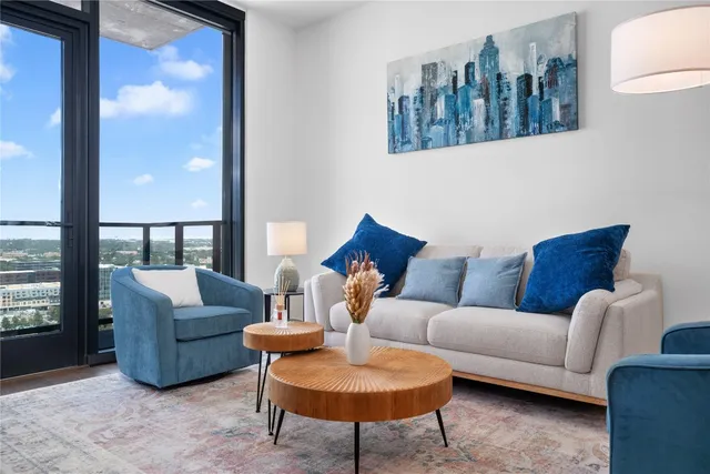 a living room with furniture and a window