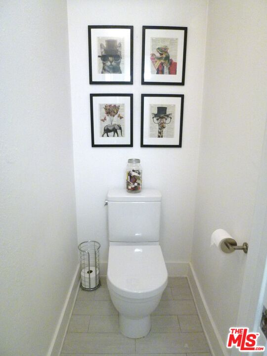 717 Crestmoore Place Venice, CA 90291 - Photo 9 of 18 a white toilet sitting next to a bathroom sink