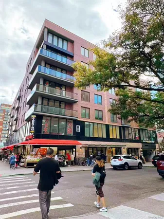 a city street lined with buildings and cars