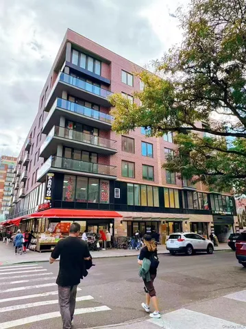 a city street lined with buildings and cars