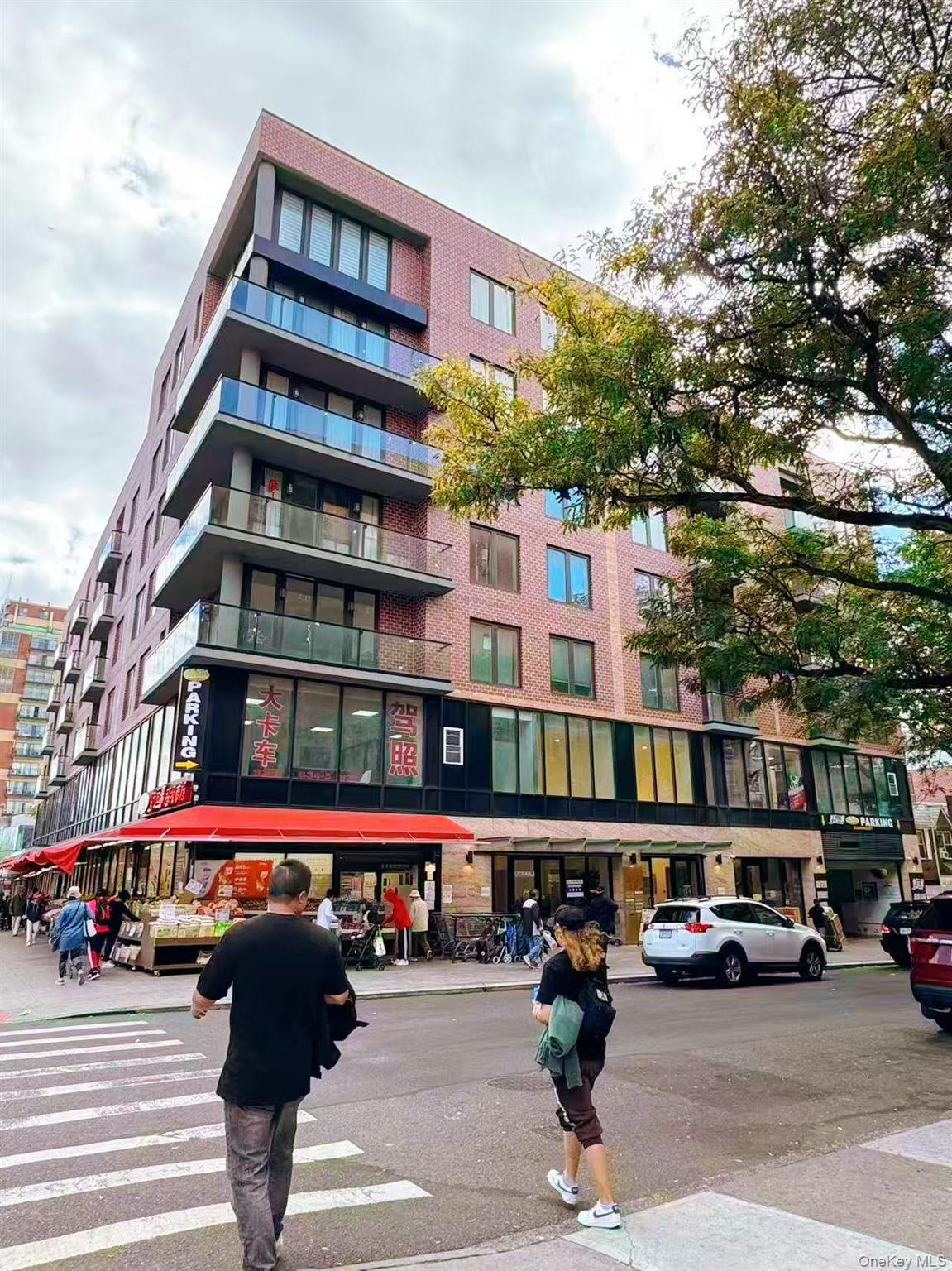 a city street lined with buildings and cars