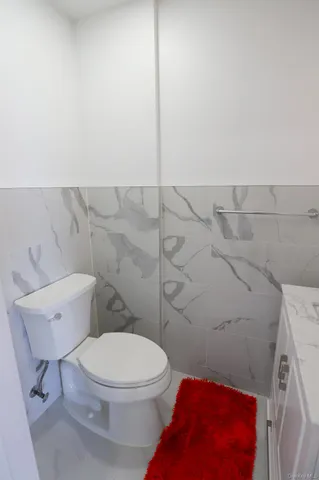 an empty room with a empty space and windows