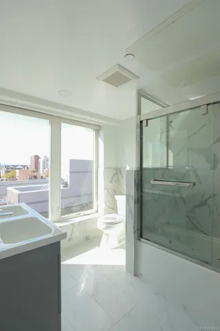 a bathroom with a tub and sink