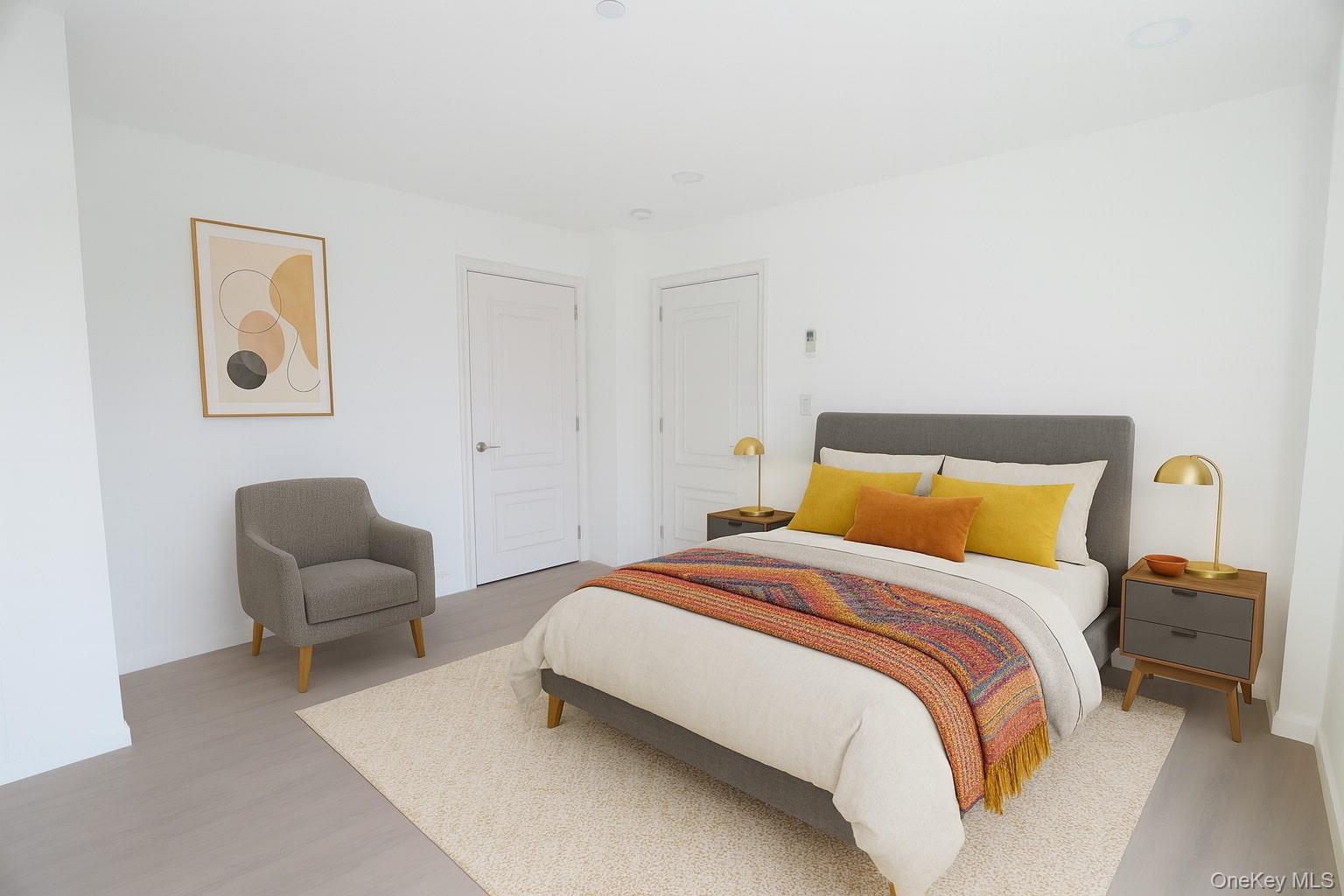 42-78 Main Street, Unit 6E Queens, NY 11355 - Photo 28 of 33 a bedroom with a bed and chair