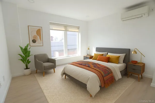 a bedroom with a bed and window