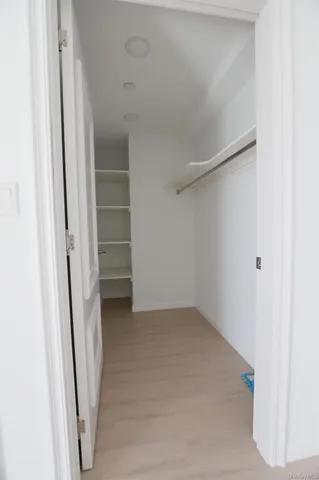 a view of an empty walk in closet