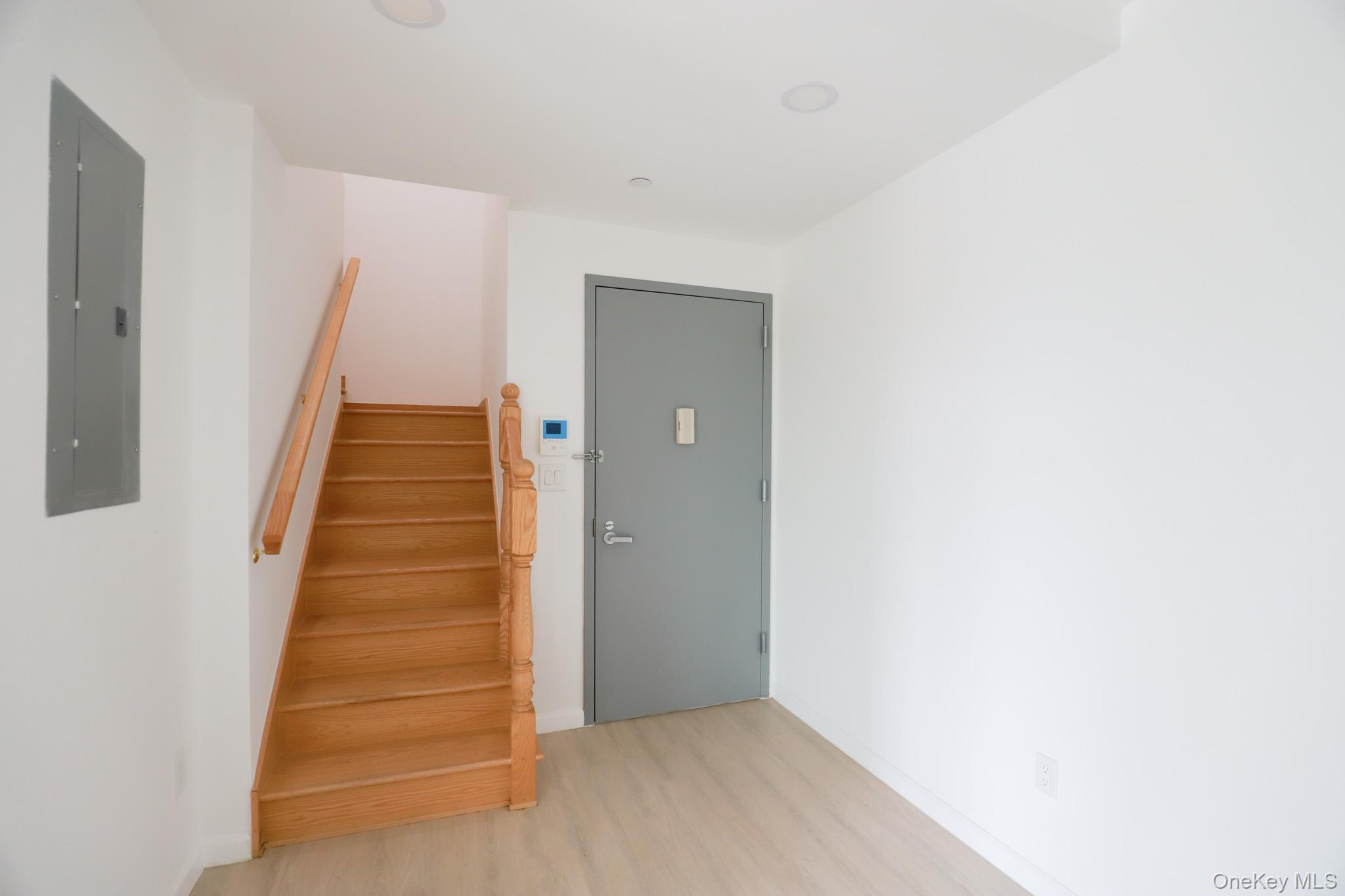 42-78 Main Street, Unit 6E Queens, NY 11355 - Photo 5 of 33 an entryway of a house with stairs