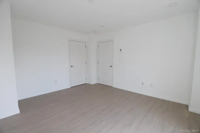 an empty room with wooden floor