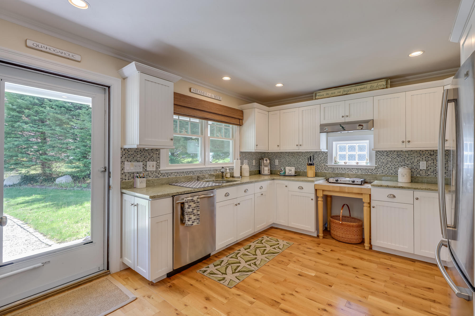50 Pheasant Way, Unit A&B Centerville, MA 02632 - Photo 11 of 62 a kitchen with a stove sink and cabinets