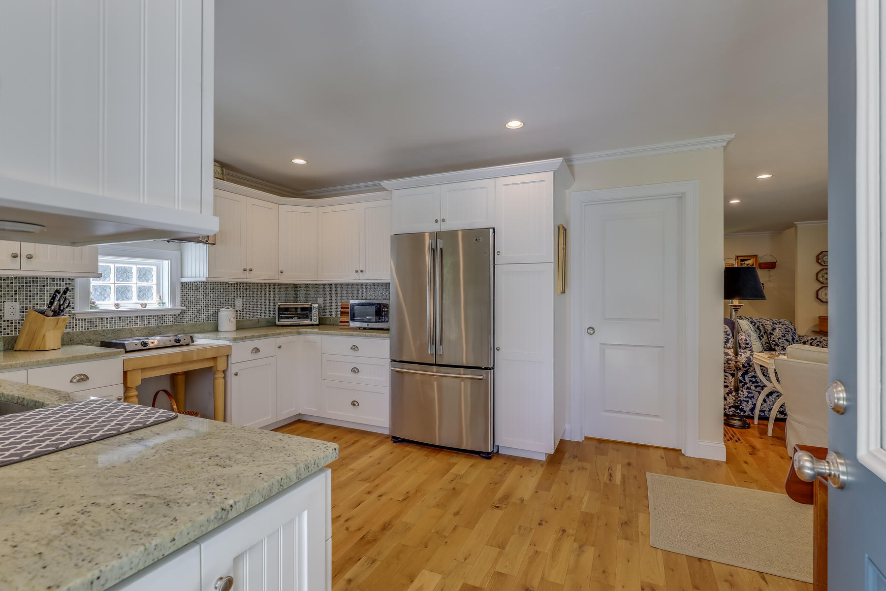 50 Pheasant Way, Unit A&B Centerville, MA 02632 - Photo 12 of 62 a kitchen with a refrigerator sink and stove