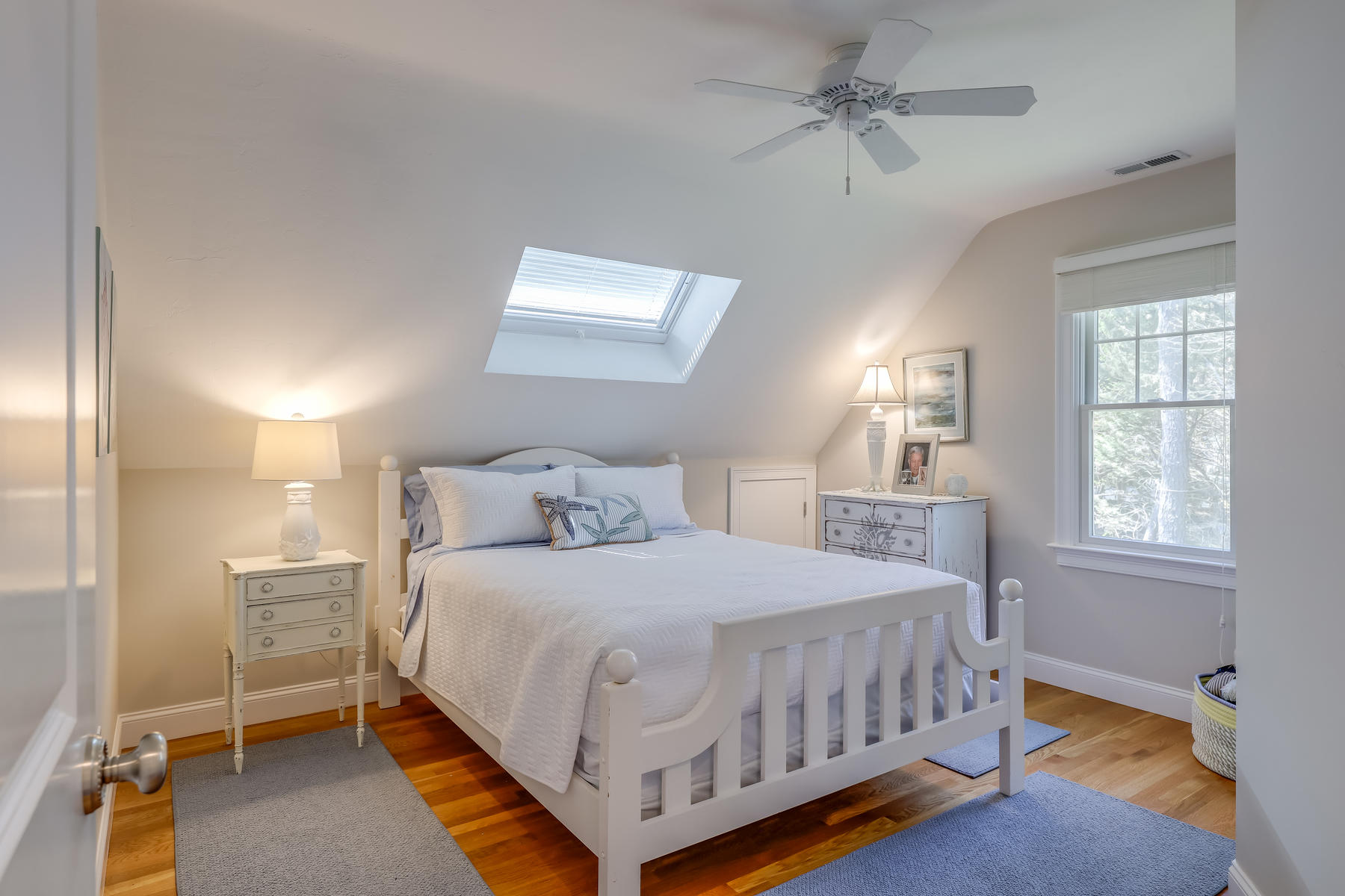 50 Pheasant Way, Unit A&B Centerville, MA 02632 - Photo 23 of 62 a bedroom with a bed a chandelier and a window