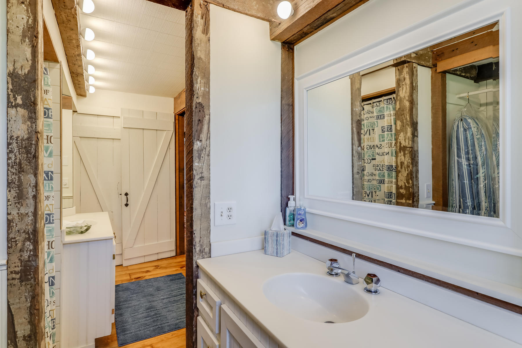 50 Pheasant Way, Unit A&B Centerville, MA 02632 - Photo 41 of 62 a bathroom with a sink a mirror and next to a window