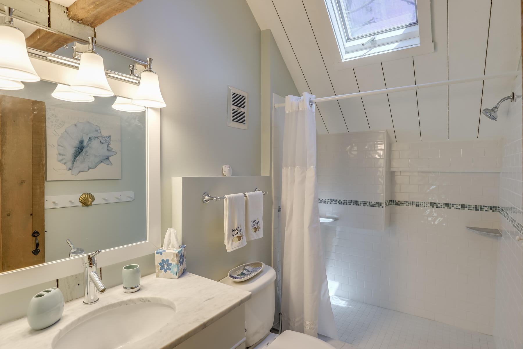 50 Pheasant Way, Unit A&B Centerville, MA 02632 - Photo 49 of 62 a bathroom with a sink and a mirror