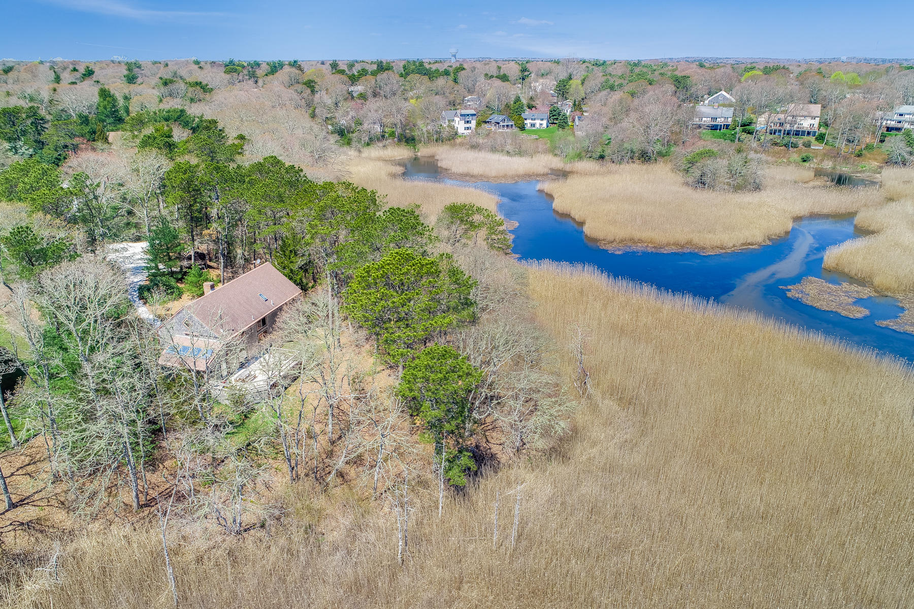 50 Pheasant Way, Unit A&B Centerville, MA 02632 - Photo 62 of 62 an aerial view of a house with a yard and lake view