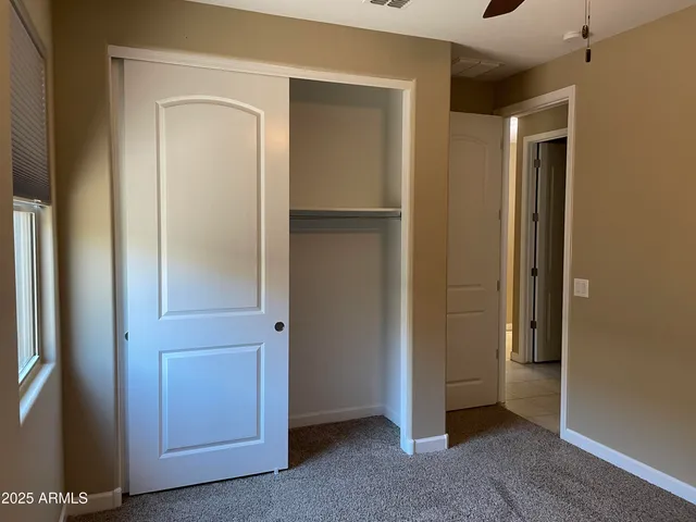 a view of a small space with a fan