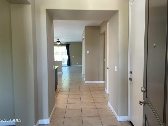 a view of a hallway with a chandelier