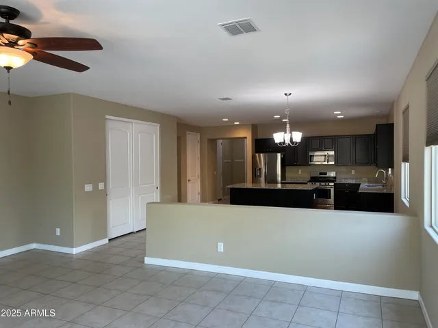 a view of a kitchen and kitchen island