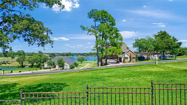 a view of a garden with a building in the background