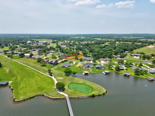 an aerial view of a house with a swimming pool
