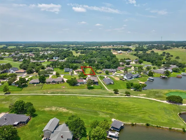 an aerial view of a houses with a yard and outdoor space