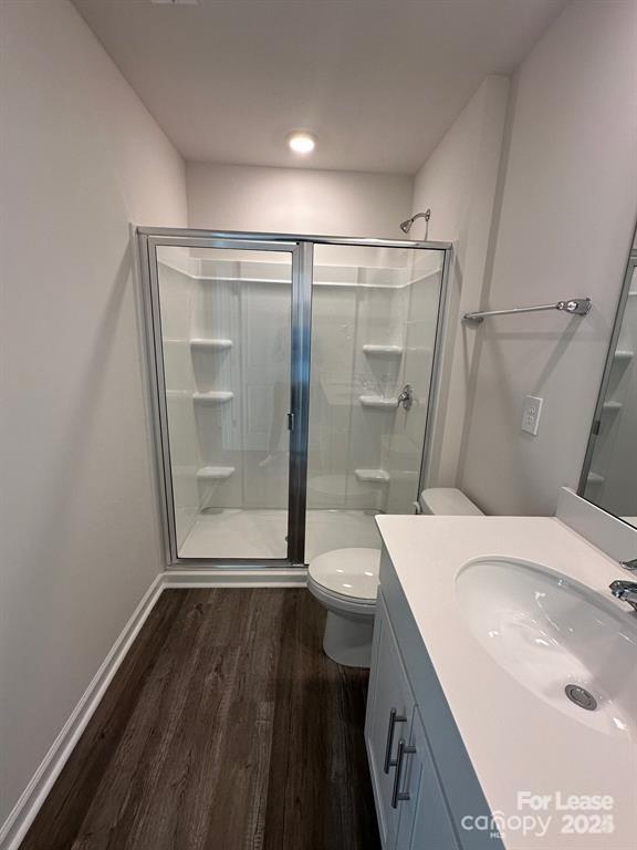 6135 Faron Way Charlotte, NC 28262 - Photo 23 of 23 a bathroom with a sink a toilet and shower