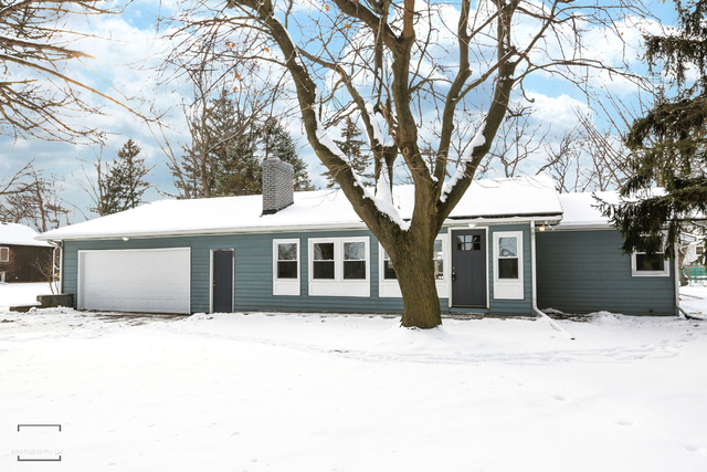 12N234 South Randall Road Elgin, IL 60123 - Photo 1 of 33 a house that has a tree in front of it