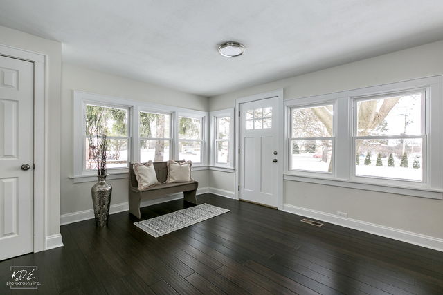 12N234 South Randall Road Elgin, IL 60123 - Photo 2 of 33 a living room with furniture and a large window