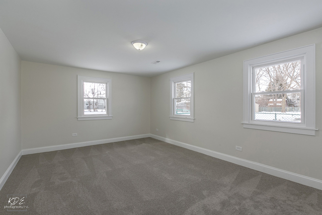 12N234 South Randall Road Elgin, IL 60123 - Photo 14 of 33 a view of an empty room with a window