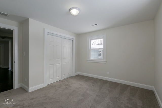 12N234 South Randall Road Elgin, IL 60123 - Photo 17 of 33 an empty room with windows
