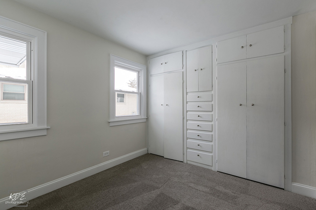 12N234 South Randall Road Elgin, IL 60123 - Photo 20 of 33 an empty room with windows and closet