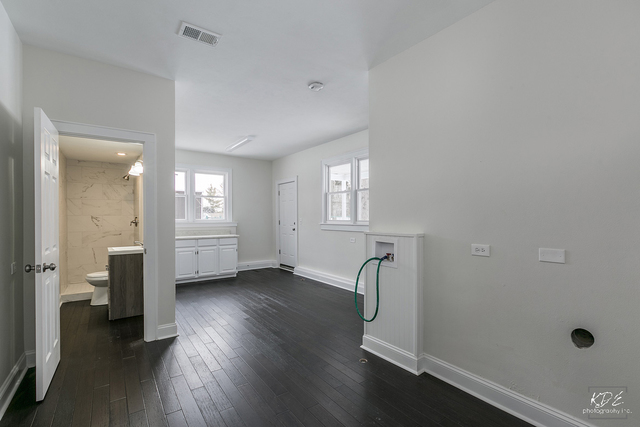 12N234 South Randall Road Elgin, IL 60123 - Photo 24 of 33 a view of a room with wooden floor and windows