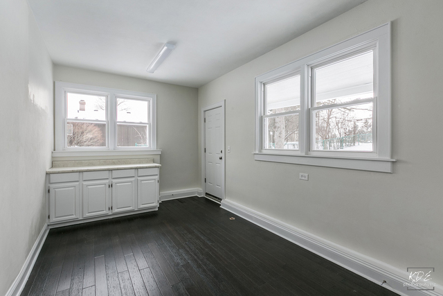 12N234 South Randall Road Elgin, IL 60123 - Photo 25 of 33 a room with a window and a wooden floor