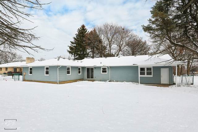12N234 South Randall Road Elgin, IL 60123 - Photo 32 of 33 a front view of a house with a yard and garage