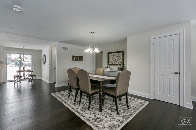 12N234 South Randall Road Elgin, IL 60123 - Photo 5 of 33 a view of a dining room with furniture and wooden floor