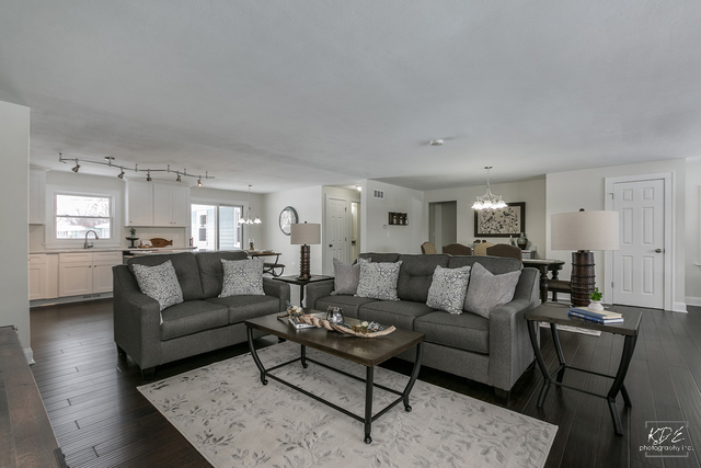 12N234 South Randall Road Elgin, IL 60123 - Photo 6 of 33 a living room with furniture and view of kitchen