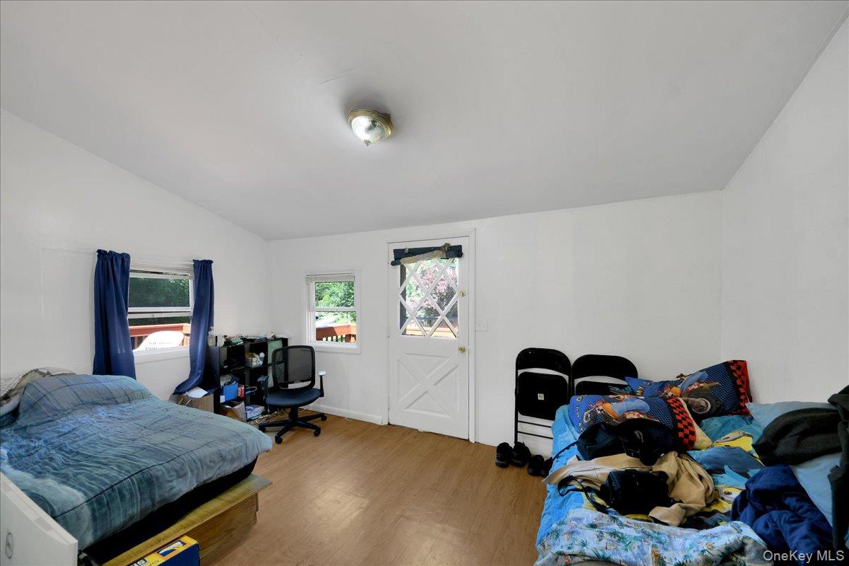 356 Sprout Brook Road Garrison, NY 10524 - Photo 10 of 25 Room off the kitchen being used as a bedroom. Leads to the deck
