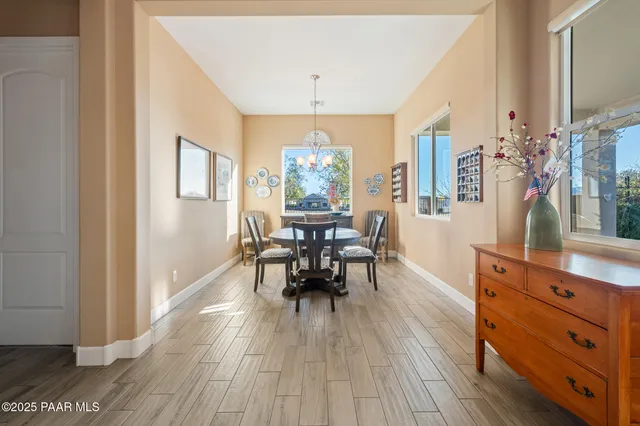 a dining room with furniture window wooden floor