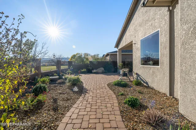 a view of a house with potted plants