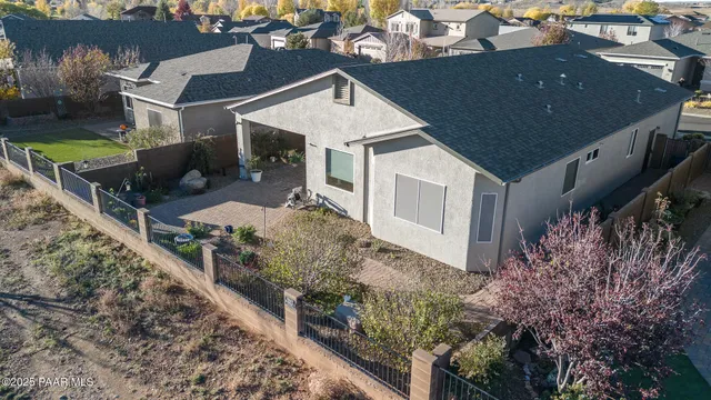an aerial view of residential houses with outdoor space