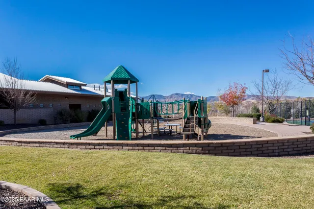 a view of a lake with houses in back