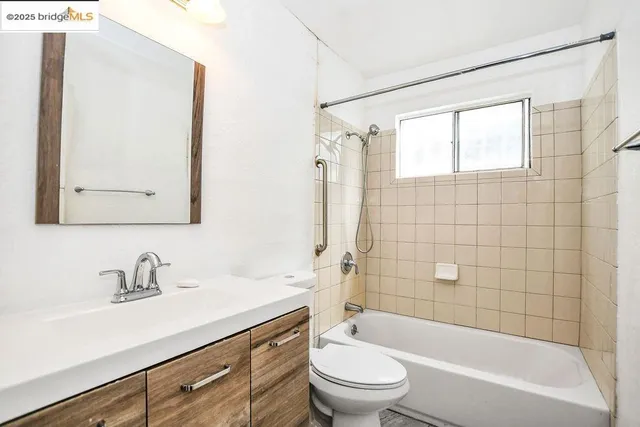 a view of living room with furniture and a window