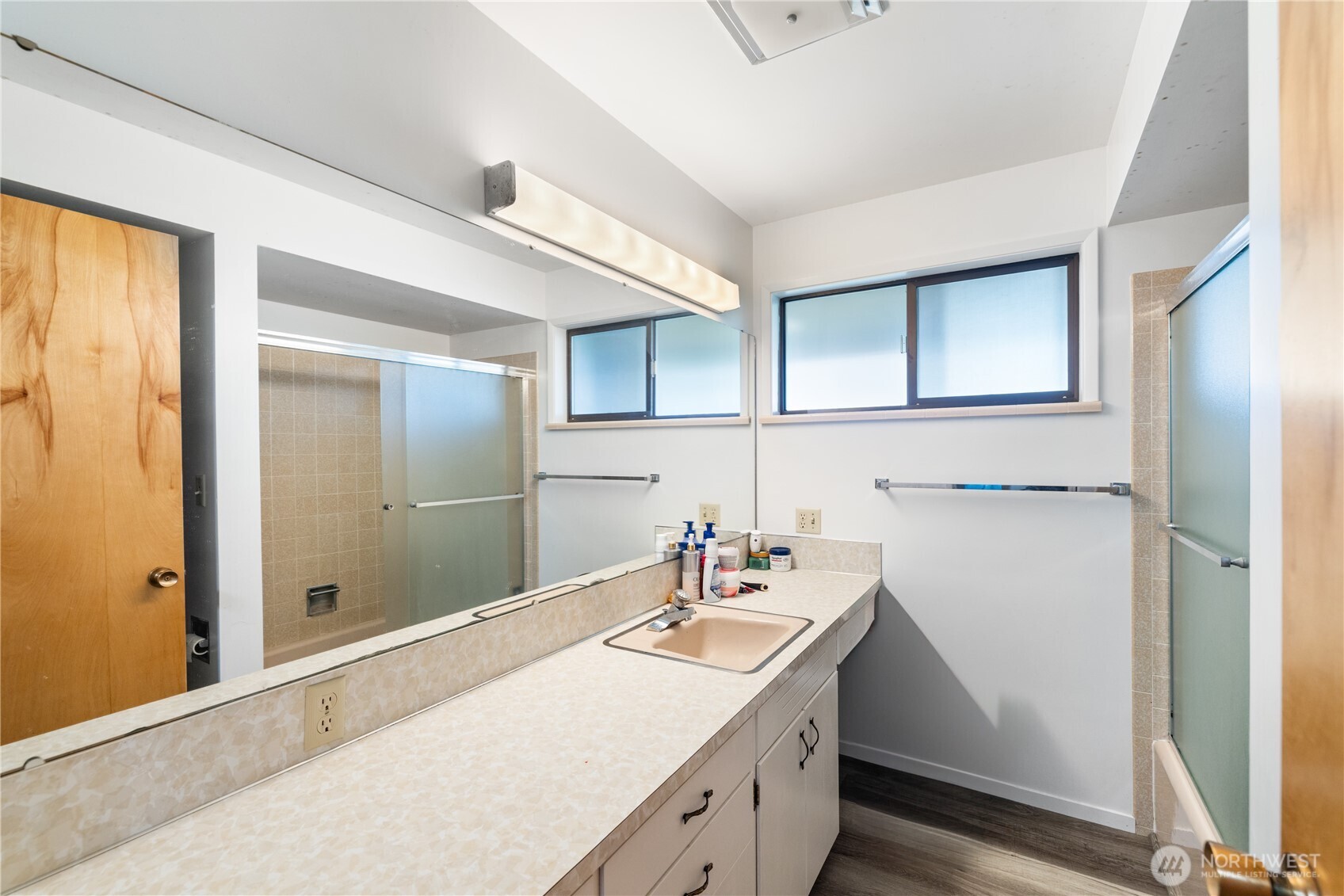 21563-21567 Cook Road Sedro-Woolley, WA 98284 - Photo 17 of 38 a bathroom with a sink a mirror and a shower